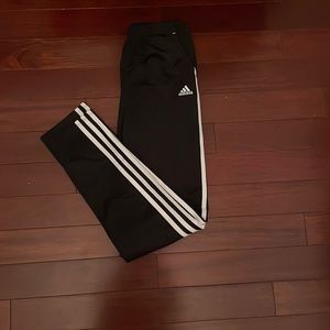 Black and white adidas joggers.